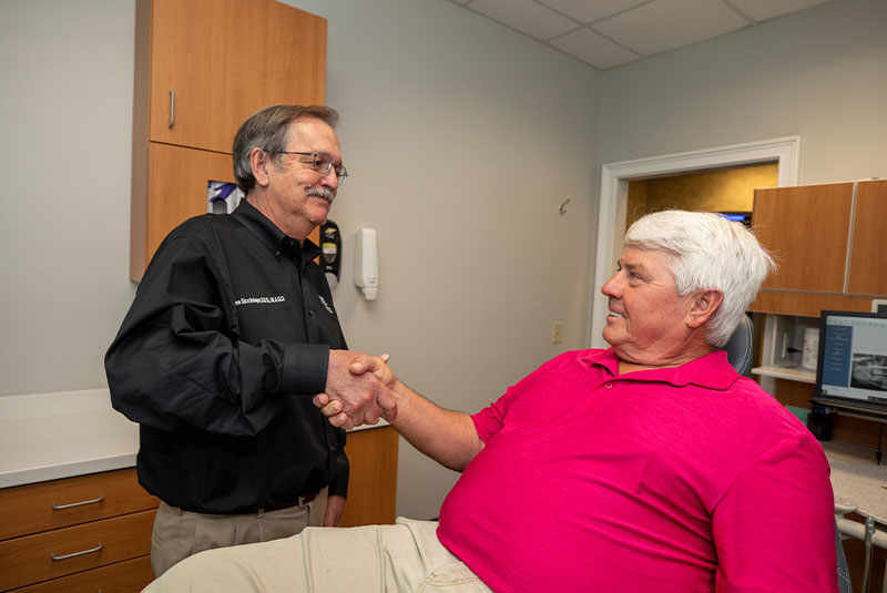 dental patient handshake with doctor